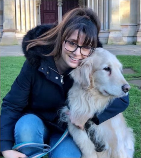 Dr Anna Cherry with a golden retriever